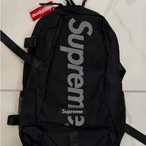 Supreme Black Mesh Backpack with Red Tag